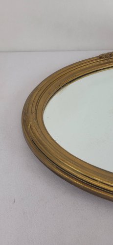 Miroir ovale en bois doré, style Louis XVI