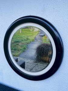 Round vintage mirror in brown resin – 1970s modernist design