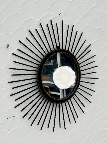 Miroir soleil vintage en métal noir et doré années 60