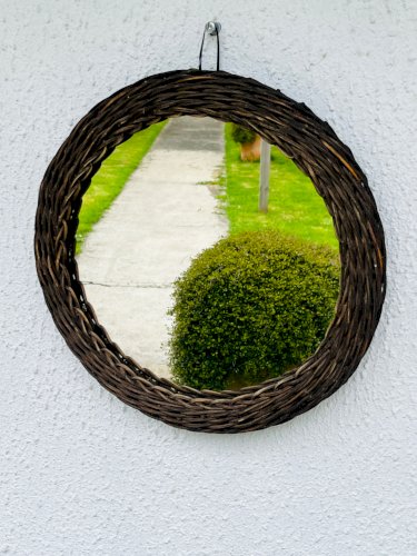 Miroir soleil vintage en osier tressé