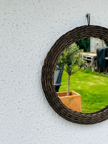 Miroir soleil vintage en osier tressé