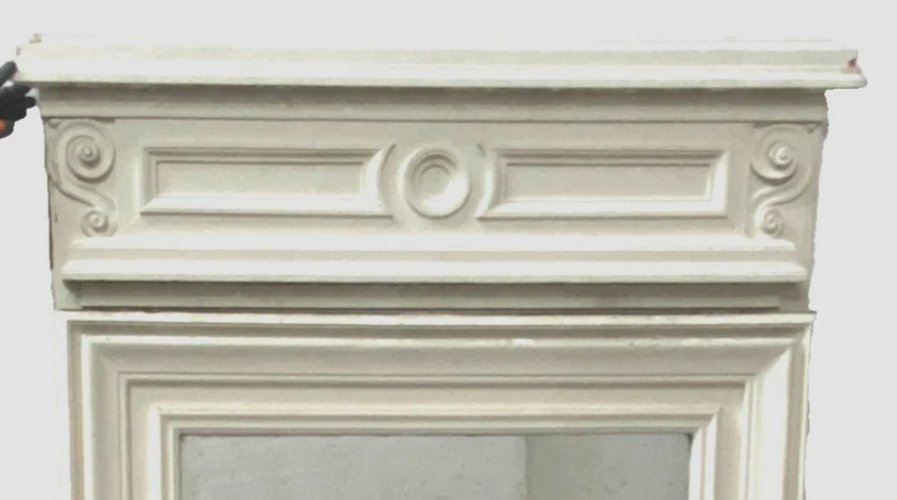 Miroir trumeau de style Louis XVI en bois et stuc patiné XIX siècle