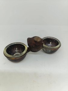 Original and antique double salt shaker made of bronze or brass with a bird design in good condition.