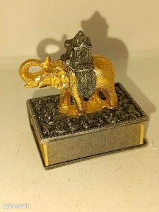 Small matchbox holder with a nicely crafted elephant design.