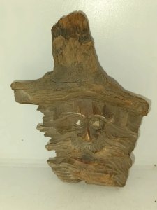 original face sculpture on wood in good condition