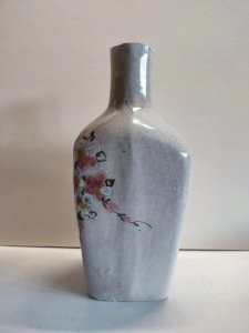Original vase bouteille à decor floral Art et ceramique signé en bon etat