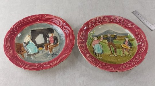 Pair of antique barbotine plates, life scenes