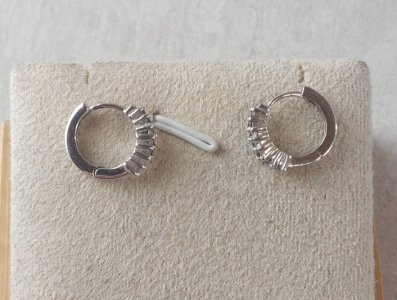 Pair of rhinestone hoop earrings, made of solid silver.
