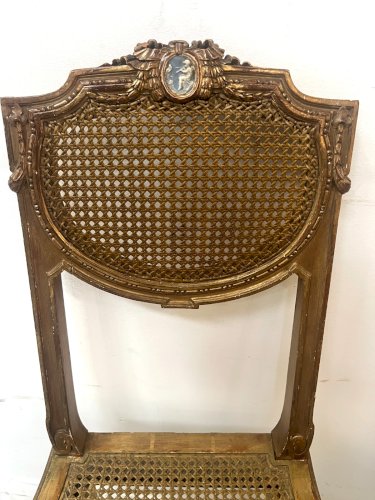 Paire de chaises de style Louis XVI en bois doré XX siècle