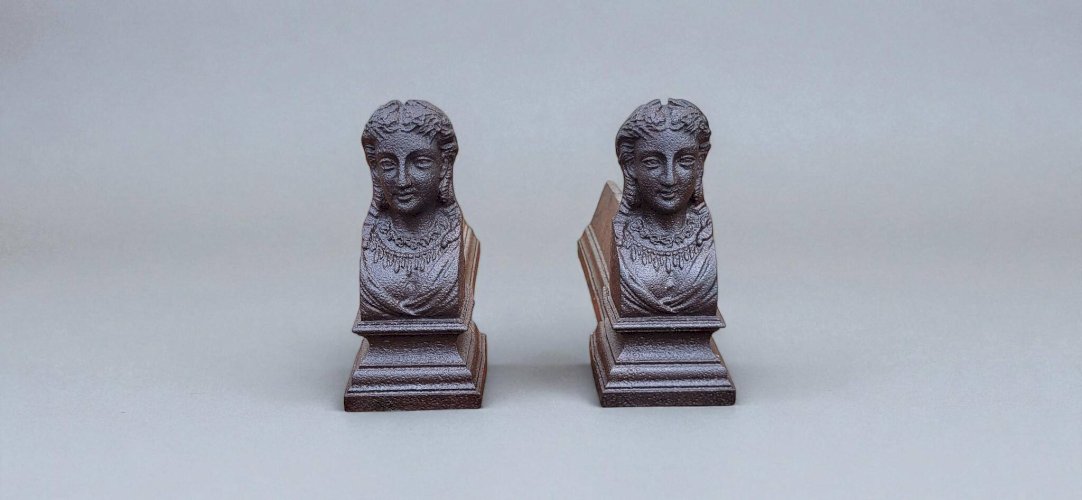 Paire de chenets en fonte