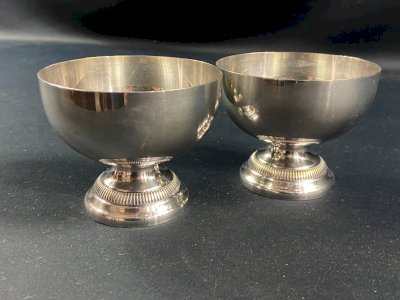 Pair of silver-plated goblets on pedestals in Louis XVI style.