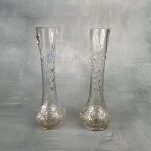 Pair of ancient vases in molded pressed glass with a relief decoration of plants.