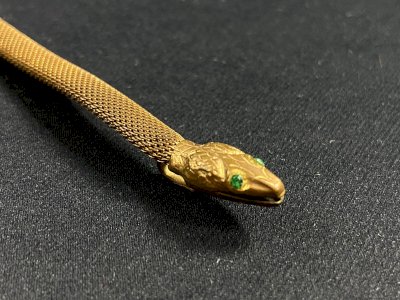 Gold metal articulated elongated snake pendant England