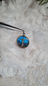 Antique religious pendant in silver and a butterfly wing