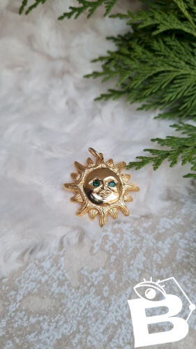 Pendentif Soleil Dalloyau année 1993 yeux vert