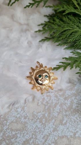 Pendentif Soleil Dalloyau année 1993 yeux vert