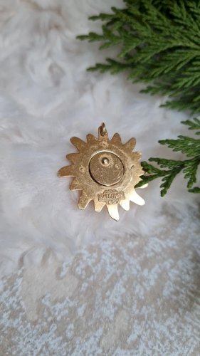 Pendentif Soleil Dalloyau année 1993 yeux vert