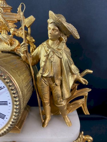 Pendule de cheminée Napoléon III au personnage masculin champêtre en métal doré