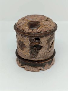 small Asian incense burner in pierced stone with black and gold patina in good condition