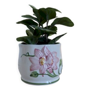 Small vintage pottery cachepot with raised flower motif in pink.