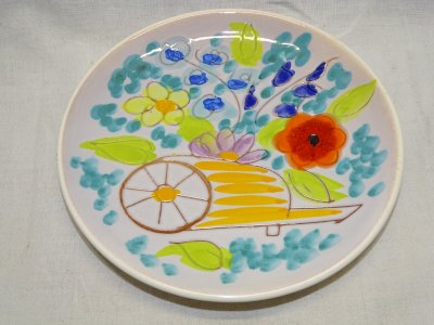 -SMALL PLATE VALLAURIS DECORATED WITH WHEELBARROW AND COLORED FLOWERS SIGNED D