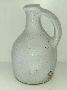 Ceramic pitcher signed by Jeanne and Norbert Pierlot in good condition.