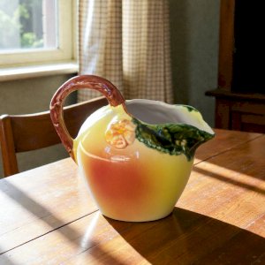 Vintage earthenware pitcher in the shape of an apple, hand-painted.