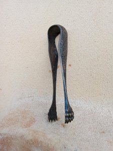 Antique sugar tongs with claws and plant decoration