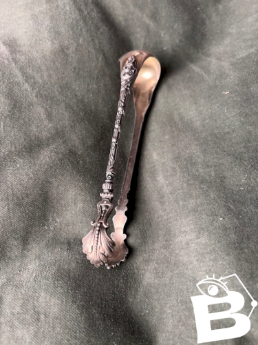 Pince à sucre en argent massif XIXe