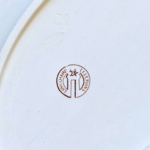 Plat ovale du XIXe siècle en terre de fer signé Longchamp Liserons