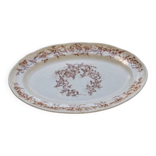 Plat ovale du XIXe siècle en terre de fer signé Longchamp Liserons