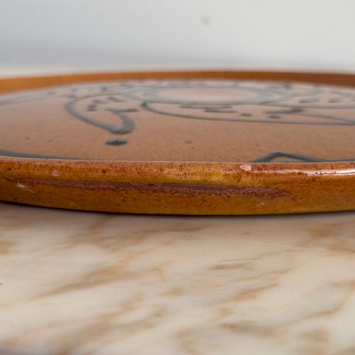 Plat rond en terre vernissée par Biot XXe décor stylisé M3684