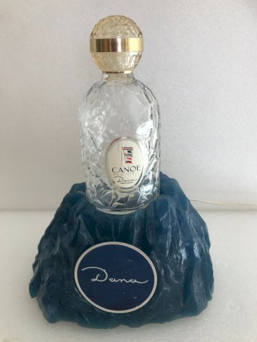 PLV plastique façon rocher éclairant parfum Dana + bouteille Canoé sans parfum