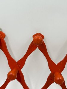Vintage orange accordion coat rack