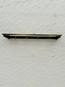 Vintage wooden and brass wall coat rack from the 70s.