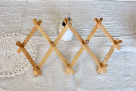 Vintage retractable pine wood wall-mounted coat rack