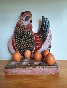 Vintage glazed terracotta chicken, egg holder decoration.