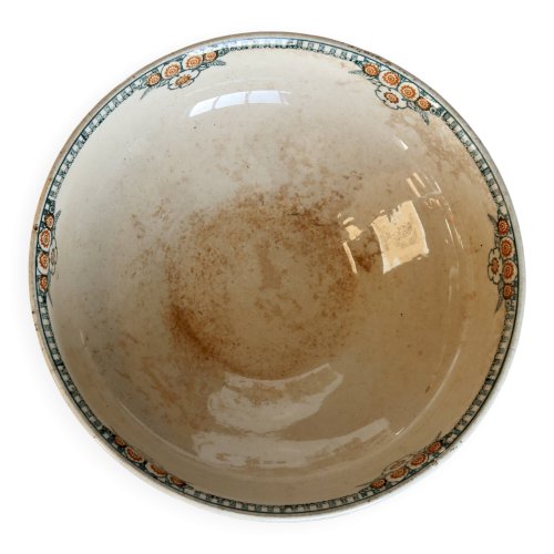 Saladier ancien en terre de fer à décor floral vert et orange