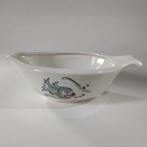 Antique sauce boat made of semi-opaque porcelain by Céranord.