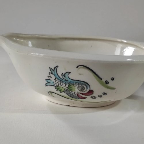 Saucière ancienne en porcelaine semi opaque de Céranord
