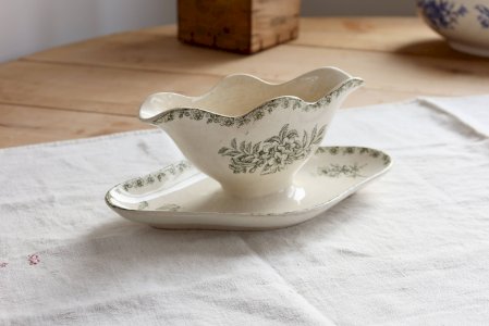 Old ironstone gravy boat ivory with green floral and butterfly décor.