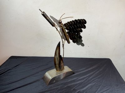 abstract sculpture steel butterfly on modern contemporary reed
