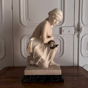 Alabaster sculpture of a young woman holding a bronze snake 1930 M3742