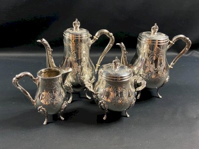 Silver-plated metal tea service in Louis XV style, coffee pot, teapot, sugar bowl.