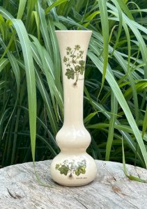 Creamy white solo flower with botanical patterns