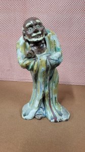 19th CENTURY GLAZED EARTH ASIAN STATUE