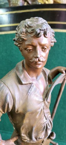STATUE EN REGULE FERMIER LE FAUCHEUR