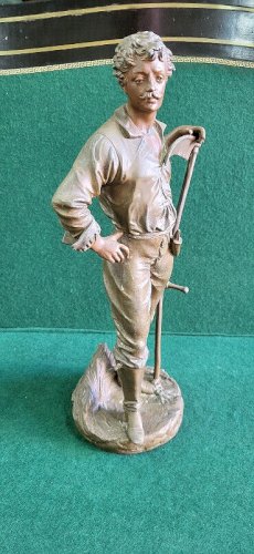 STATUE EN REGULE FERMIER LE FAUCHEUR