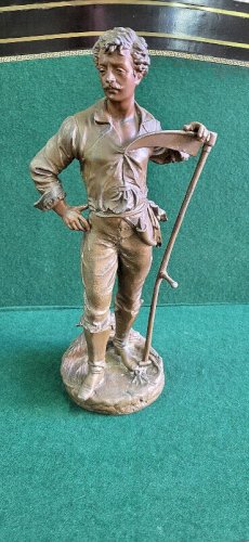 STATUE EN REGULE FERMIER LE FAUCHEUR