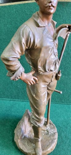 STATUE EN REGULE FERMIER LE FAUCHEUR